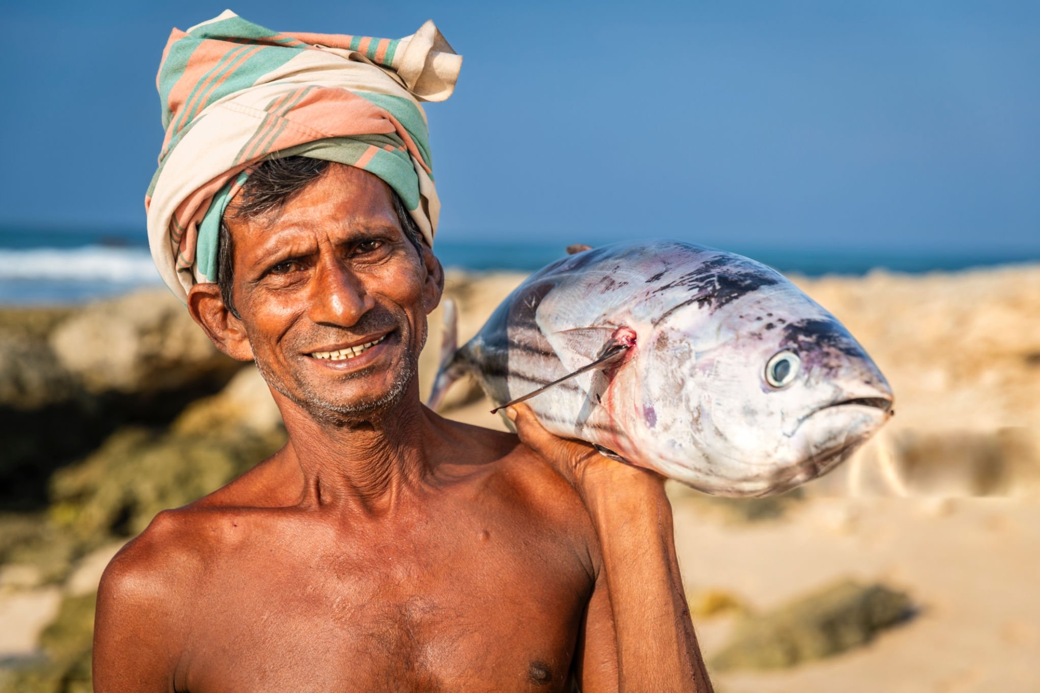 Sri Lankan fisherman with fresh Indian Ocean catch